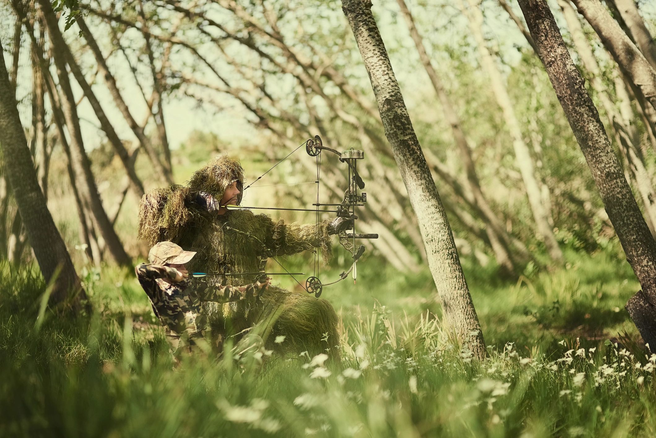 Outdoor shooting companions preparing for a guided session